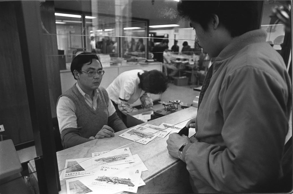 A collector buys first-day covers of four stamps depicting the development of local aviation, on their release day in 1984. Photo: SCMP Archives A collector buys first-day covers of four stamps depicting the development of local aviation, on their release day in 1984. Photo: SCMP Archives