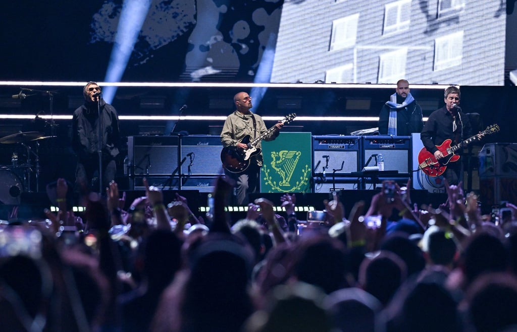(From left) Liam Gallagher, Paul Arthurs and Noel Gallagher of Oasis perform on August 31, 2025, at MetLife Stadium in New Jersey. Photo: AP