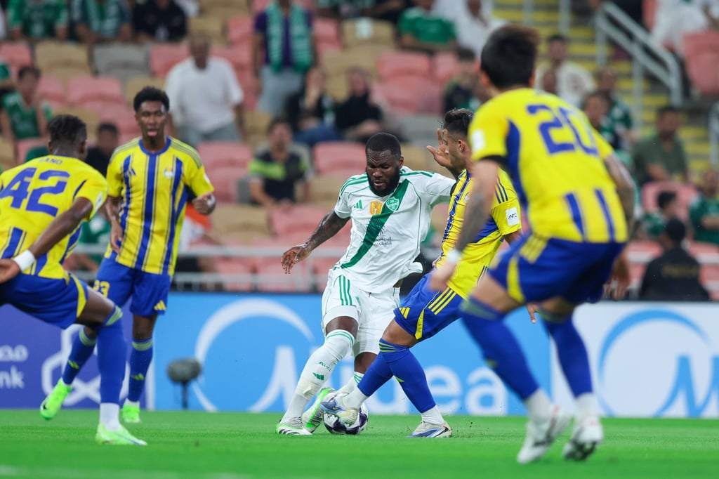 Franck Kessie (centre) battles for the ball against Al-Gharafa. Photo: Getty Images Franck Kessie (centre) battles for the ball against Al-Gharafa. Photo: Getty Images