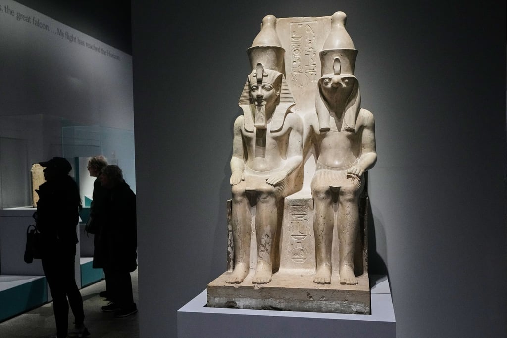 A double statue of King Haremhab and the god Horus is displayed at the exhibition. Photo: AP