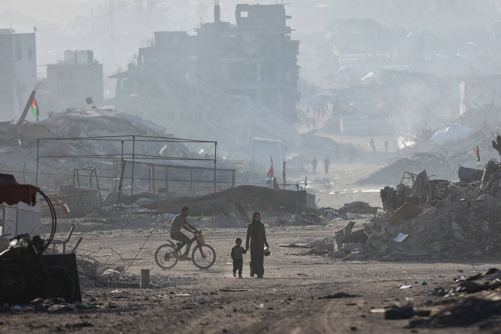 Palestinians walk amid the rubble of destroyed buildings in Gaza City on Wednesday. Photo: AFP