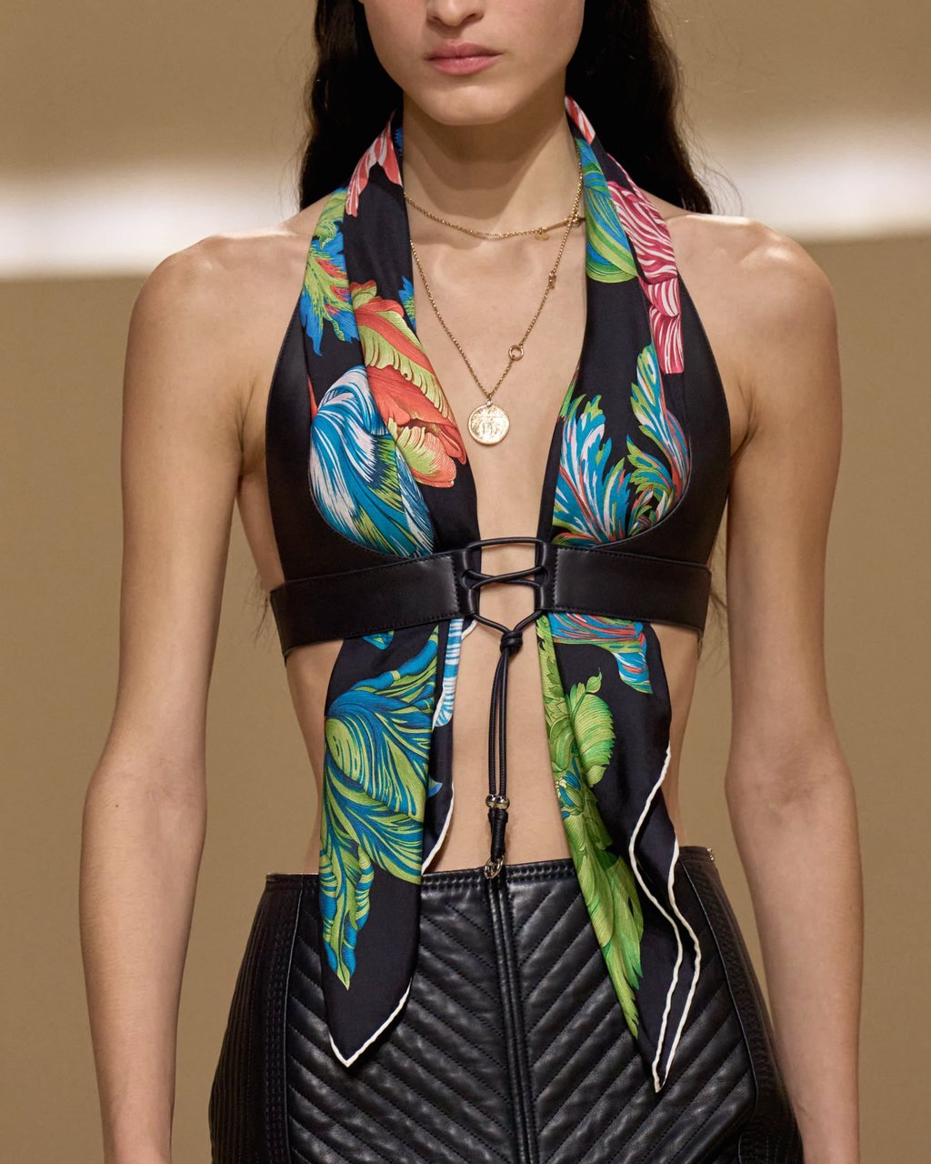 Hermès classics are transformed into sculptural chokers intertwined with necklaces or folded into tops harnessed by leather brassières. Photo: Handout