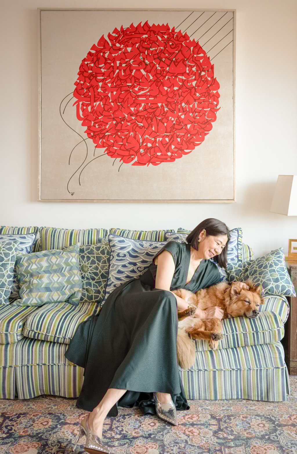 Kitty Go and her dog in her Mid-Levels home in Hong Kong. Photo: Eugene Chan