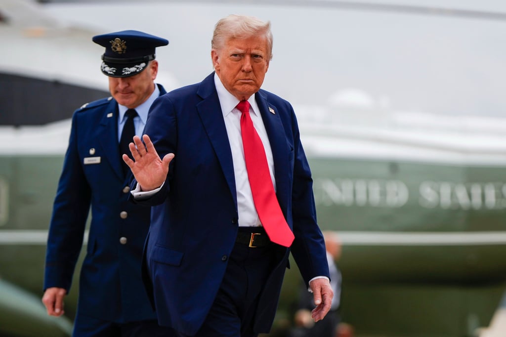 US President Donald Trump waves goodbye as he walks to board Air Force One last month. Photo: AP US President Donald Trump waves goodbye as he walks to board Air Force One last month. Photo: AP