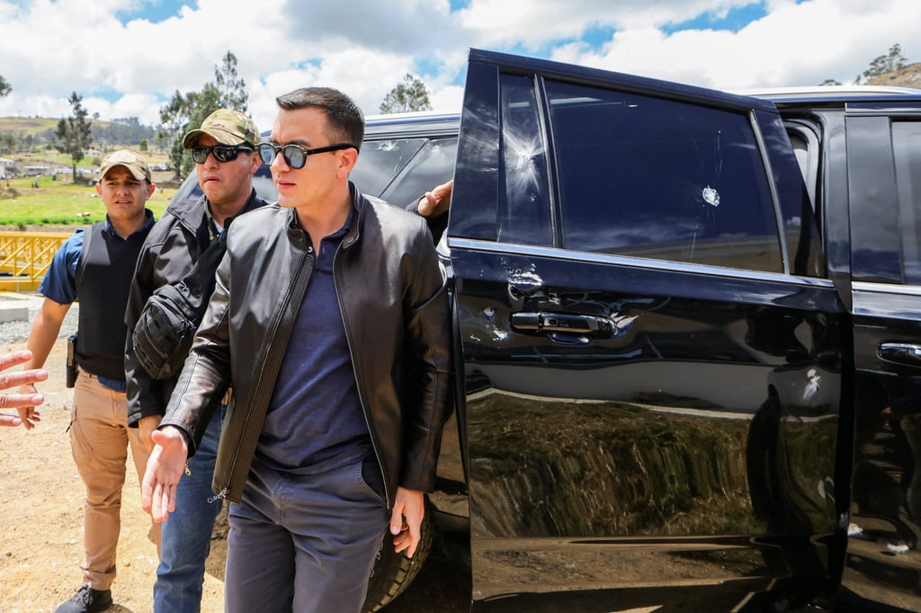 Ecuador’s President Daniel Noboa next to a car showing signs of damage after his motorcade was attacked by a crowd throwing rocks. Photo: Ecuador Presidency via Reuters Ecuador’s President Daniel Noboa next to a car showing signs of damage after his motorcade was attacked by a crowd throwing rocks. Photo: Ecuador Presidency via Reuters