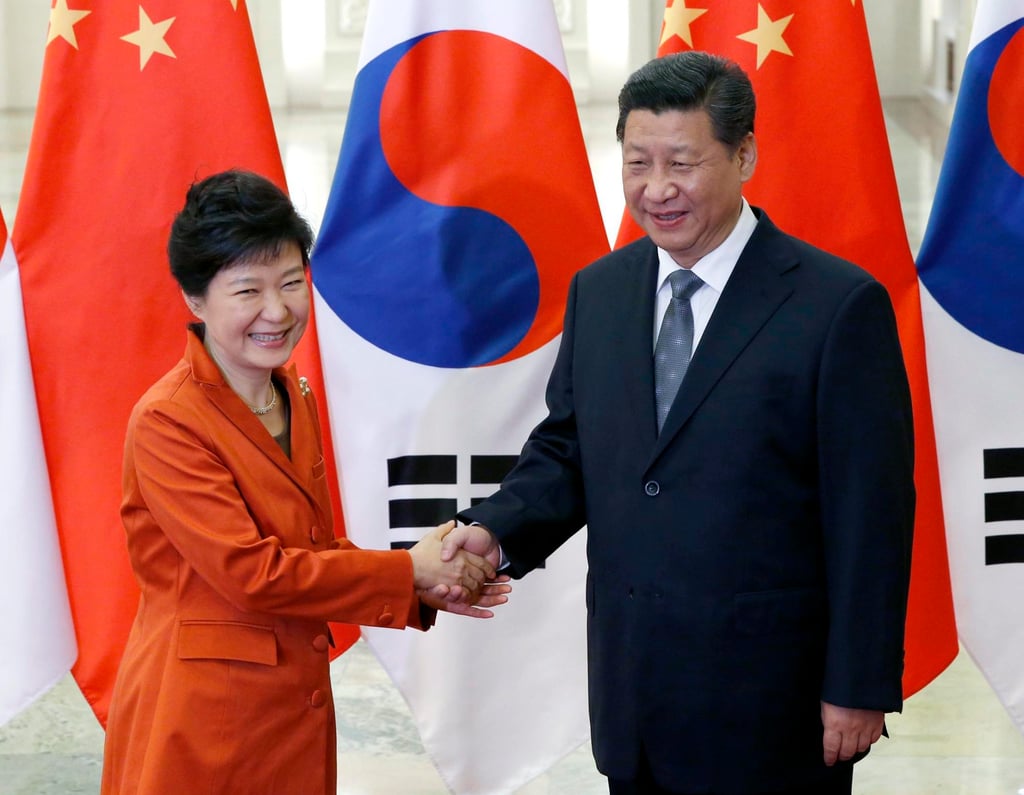 Chinese President Xi Jinping shakes hands with former South Korean president Park Geun-hye during an Apec summit in Beijing in 2014. Photo: EPA Chinese President Xi Jinping shakes hands with former South Korean president Park Geun-hye during an Apec summit in Beijing in 2014. Photo: EPA