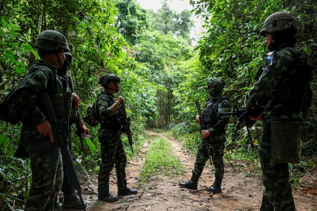 Thai military personnel stand near the disputed border between Thailand and Cambodia in the Chong Bok area in August. Photo: Reuters Thai military personnel stand near the disputed border between Thailand and Cambodia in the Chong Bok area in August. Photo: Reuters