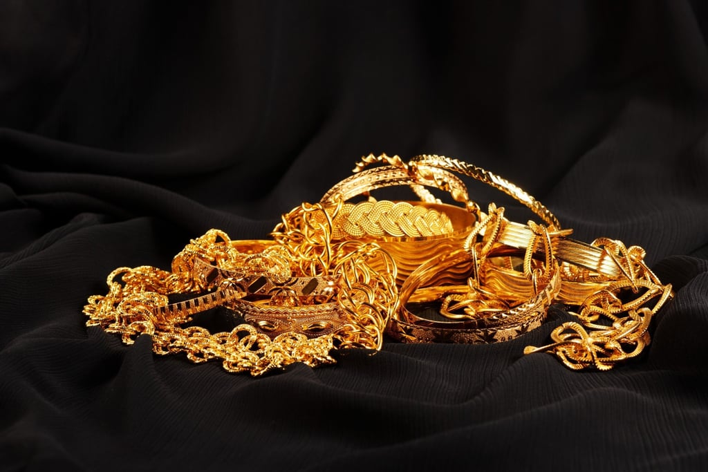 Zhao forced the woman to unlock her safe and stole gold items weighing a total of 230 grams, valued at over 200,000 yuan, along with 2,000 yuan in cash. Photo: Shutterstock Zhao forced the woman to unlock her safe and stole gold items weighing a total of 230 grams, valued at over 200,000 yuan, along with 2,000 yuan in cash. Photo: Shutterstock