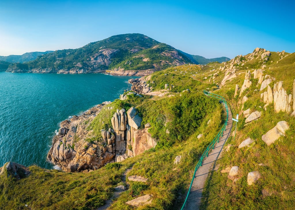 Can you see it to the left of the path? The hand-shaped “Buddha’s Hand Rock” is one of the most famous rock formations on Hong Kong’s Po Toi Island.