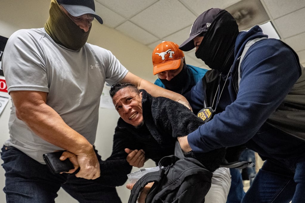 ICE agents and federal officers detain a migrant at a US immigration court in New York City. Photo: Reuters ICE agents and federal officers detain a migrant at a US immigration court in New York City. Photo: Reuters