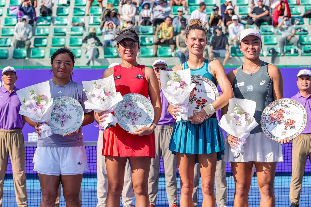 Eudice Chong (second from left) and Taiwanese partner Liang En-shuo (left) lost to Indonesia’s Janice Tjen (right) and Poland’s Katarzyna Piter at the Guangzhou Open on Sunday. Photo: AFP Eudice Chong (second from left) and Taiwanese partner Liang En-shuo (left) lost to Indonesia’s Janice Tjen (right) and Poland’s Katarzyna Piter at the Guangzhou Open on Sunday. Photo: AFP
