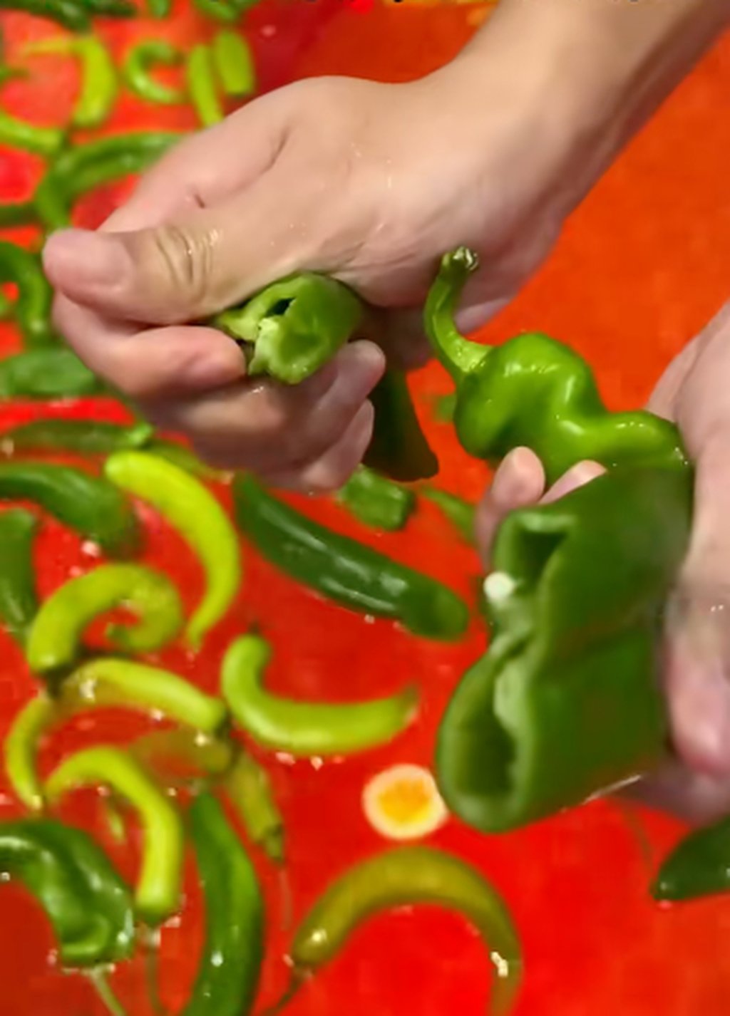 The red pool is filled with chilli peppers, eggplants and cabbage, resembling a spicy broth, while the white pool consists of milk, red dates and goji berries, similar to a clear soup. Photo: RedNote The red pool is filled with chilli peppers, eggplants and cabbage, resembling a spicy broth, while the white pool consists of milk, red dates and goji berries, similar to a clear soup. Photo: RedNote