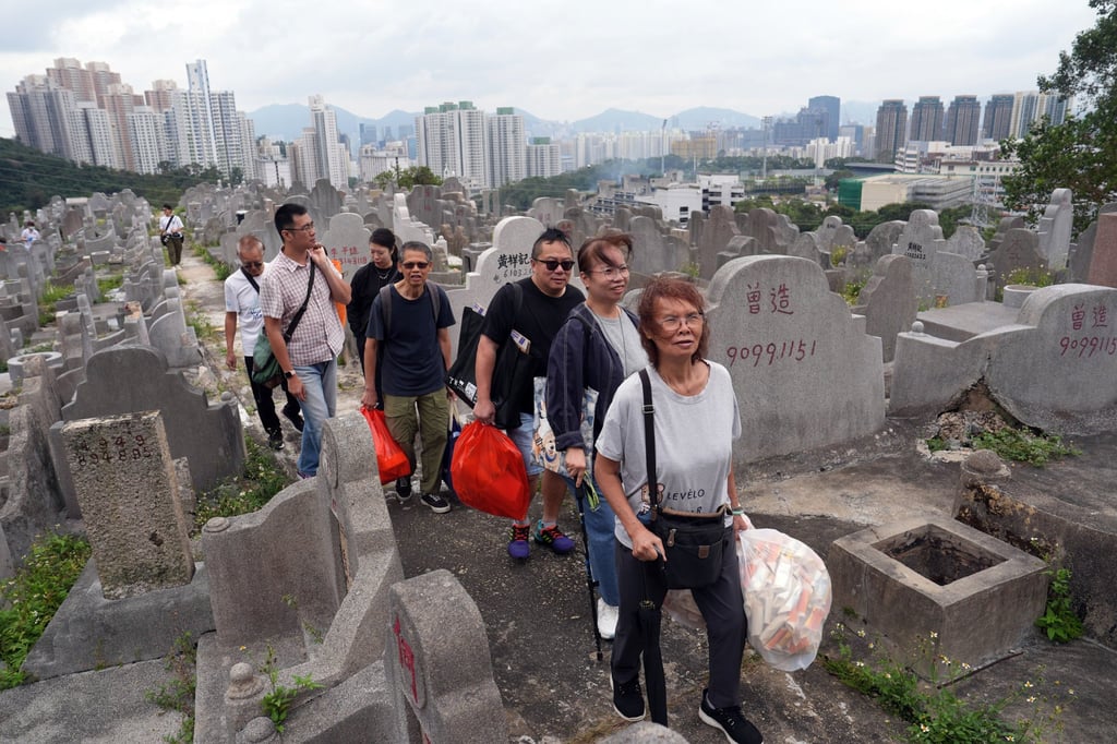 Some grave sweepers say they are not worried about chikungunya as they have prepared mosquito repellent patches. Photo: Elson Li Some grave sweepers say they are not worried about chikungunya as they have prepared mosquito repellent patches. Photo: Elson Li