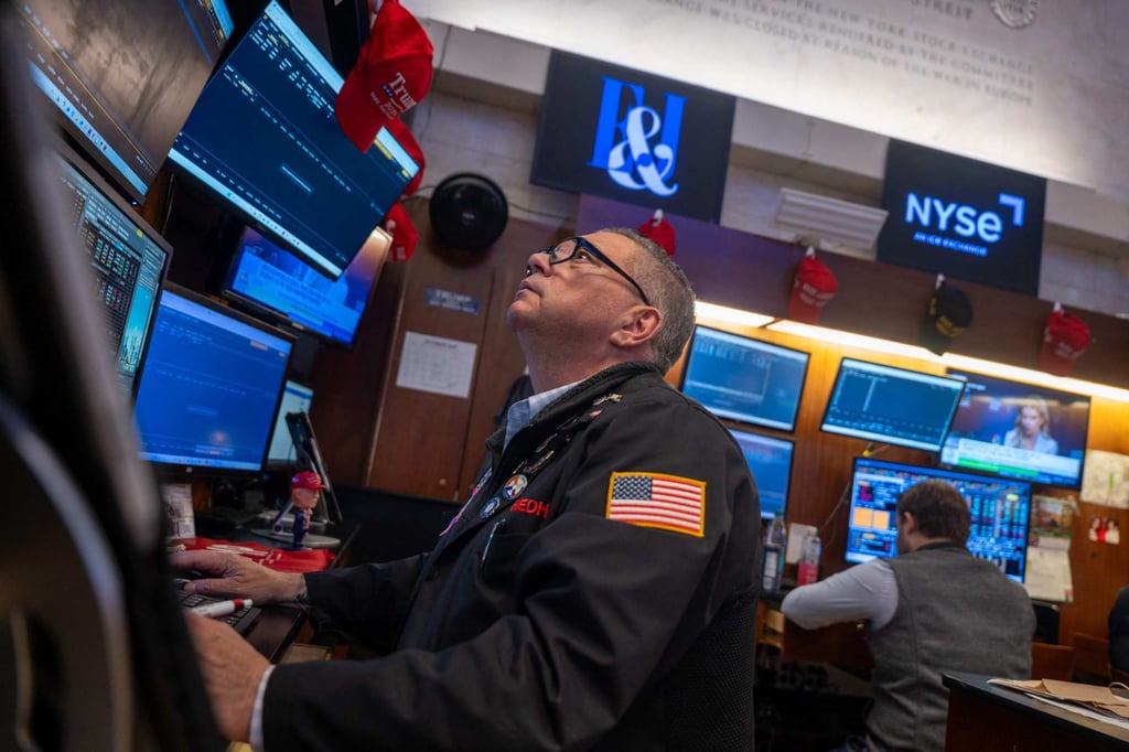 Traders work on the floor of the New York Stock Exchange on Wednesday. Photo: AFP Traders work on the floor of the New York Stock Exchange on Wednesday. Photo: AFP