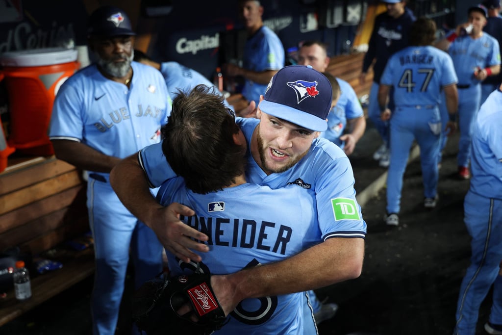Trey Yesavage celebrates with Davis Schneider in the dugout. Photo: Imagn Images via Reuters Connect