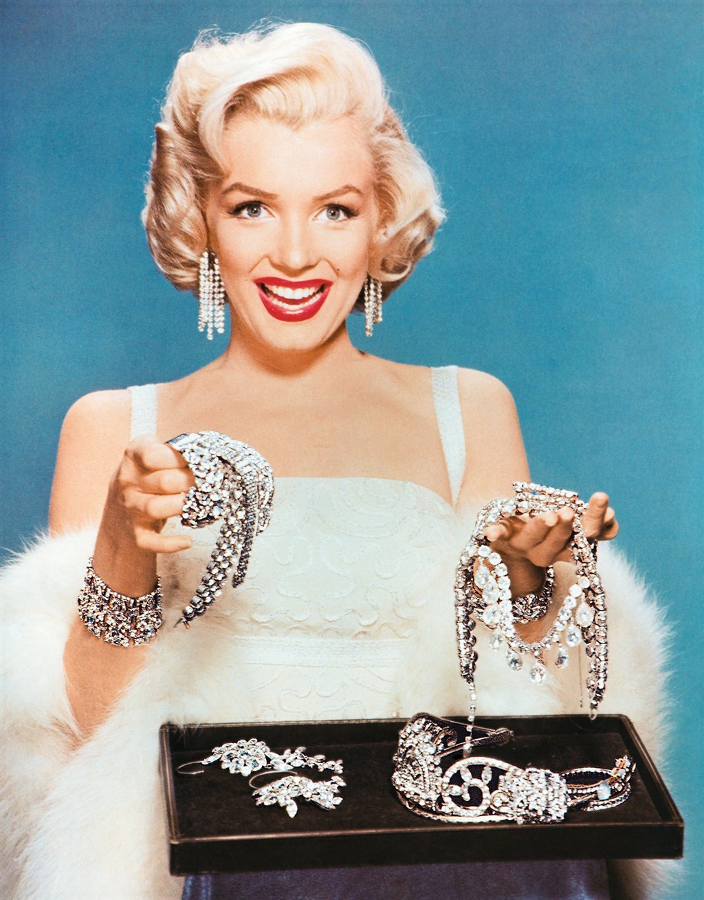 Marilyn Monroe – delighting in costume jewellery in 1955. Photo: Corbis via Getty Images