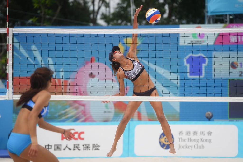 To Wing-man (right) of Hong Kong’s top pair executes a spike in the 2-0 loss to Chongqing. Photo: Elson Li