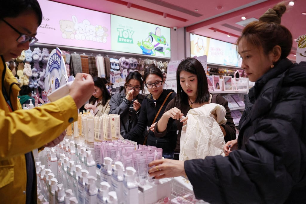 Women shop at a store in Beijing, on October 19. Photo: Reuters