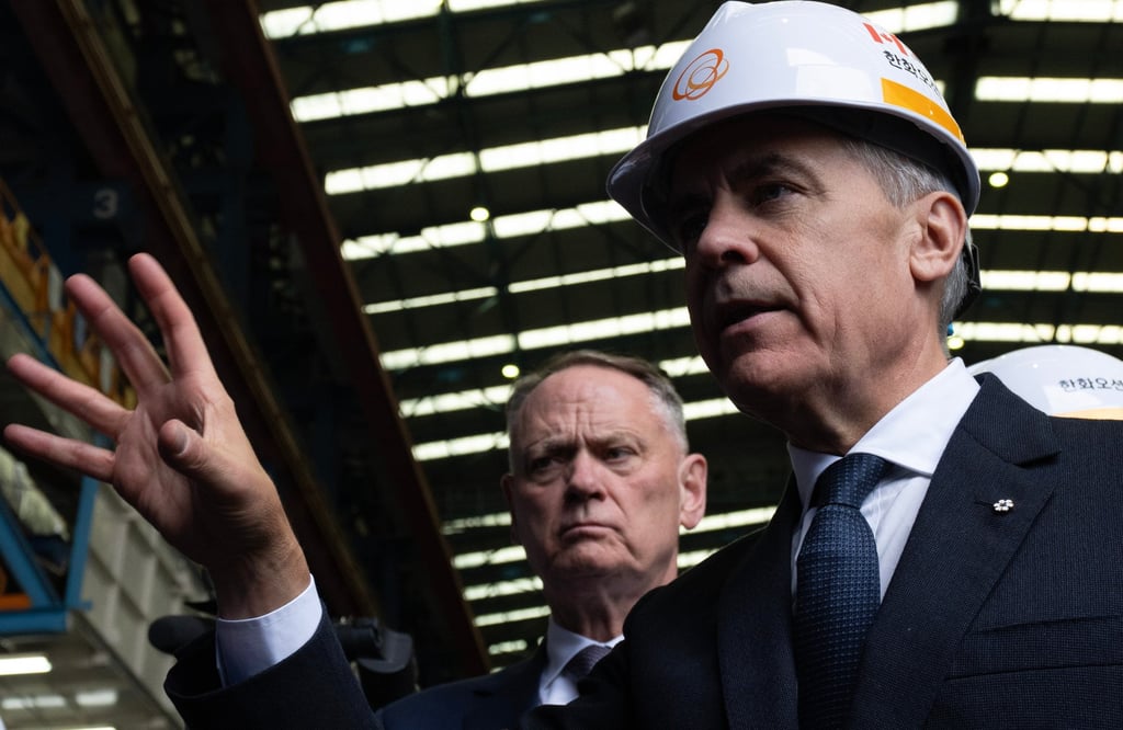 Canadian Defence Minister David McGuinty (left) and Prime Minister Mark Carney tour the Hanwha Ocean Shipyard on Geoje island, South Korea, on Thursday. Photo: The Canadian Press/AP Canadian Defence Minister David McGuinty (left) and Prime Minister Mark Carney tour the Hanwha Ocean Shipyard on Geoje island, South Korea, on Thursday. Photo: The Canadian Press/AP