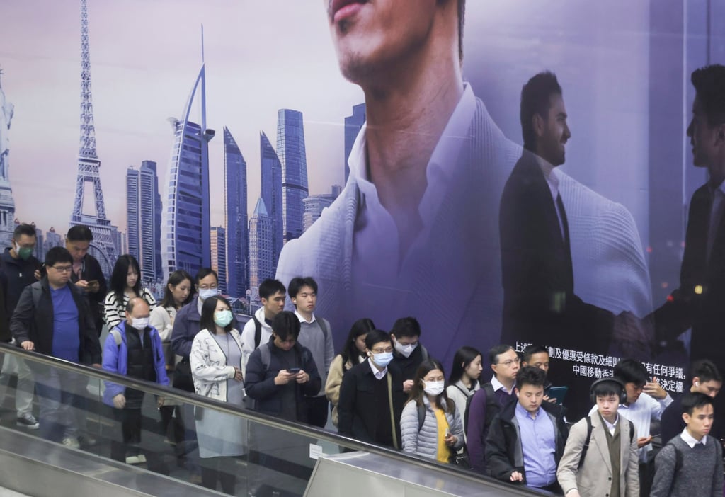 Commuters head to work, passing through Hong Kong MTR Station, on February 18. Photo: Jonathan Wong.