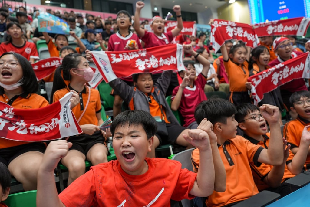 Spectators cheer for Hong Kong’s men’s team at Kai Tak on Saturday evening. Photo: Eugene Lee Spectators cheer for Hong Kong’s men’s team at Kai Tak on Saturday evening. Photo: Eugene Lee