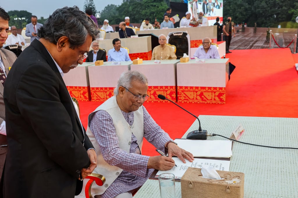 Muhammad Yunus, head of Bangladesh’s interim government, signs the July Charter of agreed upon reforms to the constitution of Bangladesh, during a ceremony at the National Parliament in Dhaka, Bangladesh, on October 17. Photo: Reuters Muhammad Yunus, head of Bangladesh’s interim government, signs the July Charter of agreed upon reforms to the constitution of Bangladesh, during a ceremony at the National Parliament in Dhaka, Bangladesh, on October 17. Photo: Reuters