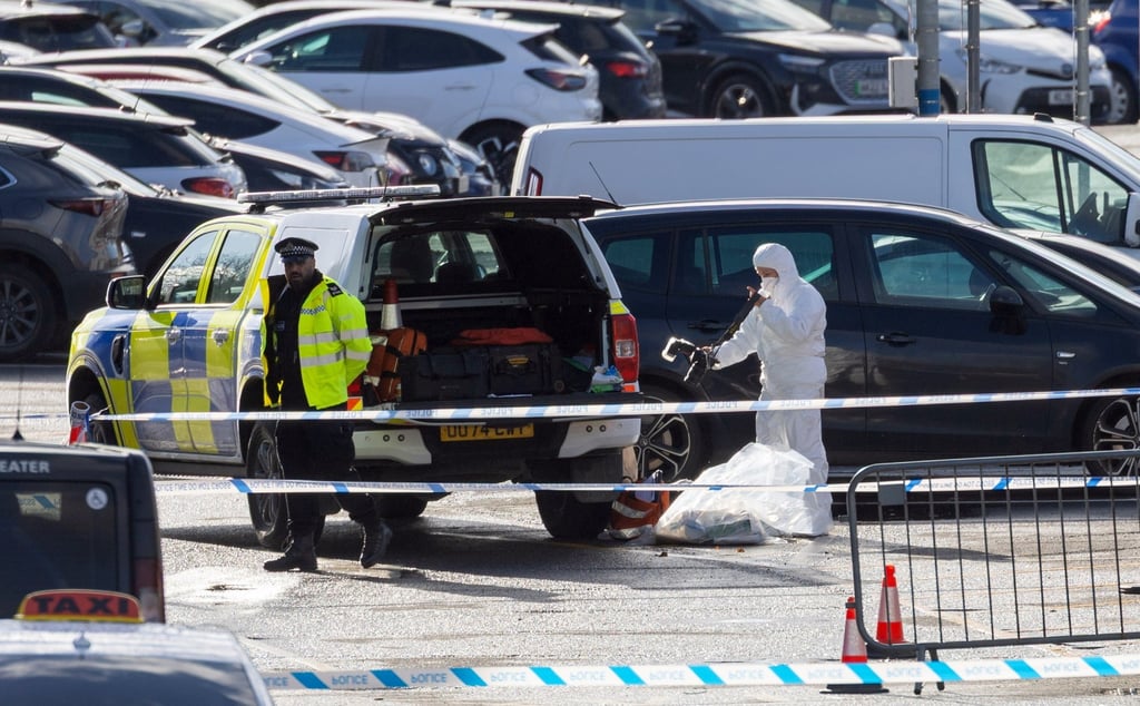 Forensic teams work at the scene at Huntington railway station on Saturday, a day after a London bound train stopped after several people were stabbed. Photo: EPA