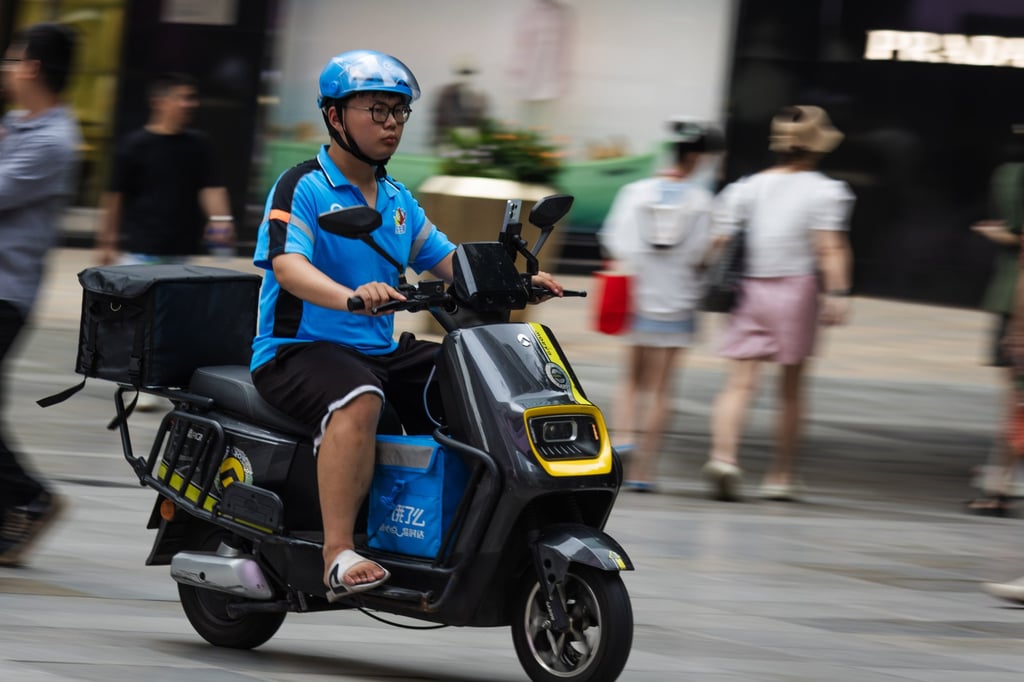 Alibaba is in the process of replacing the blue uniforms of its Ele.me drivers. Photo: Getty Images