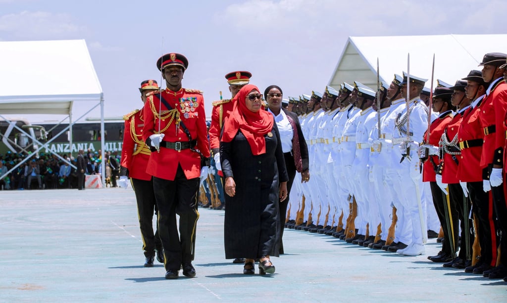 Tanzania’s President Samia Suluhu Hassan inspects a guard of honour during her swearing-in ceremony. Photo: Tanzania Presidential Press Unit via Reuters