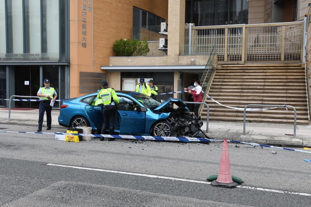 Police have arrested the male driver of the blue BMW, which was severely damaged in the accident. Photo: Handout Police have arrested the male driver of the blue BMW, which was severely damaged in the accident. Photo: Handout