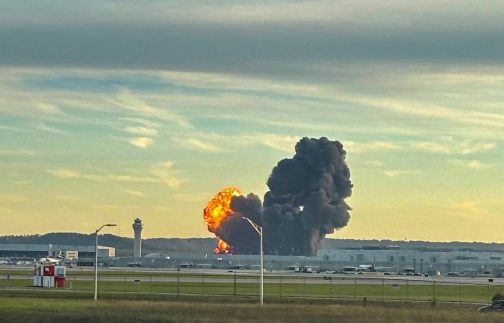 Smoke and flames rise from the site of the UPS cargo plane crash. Photo: X @LeviDean98 via AFP