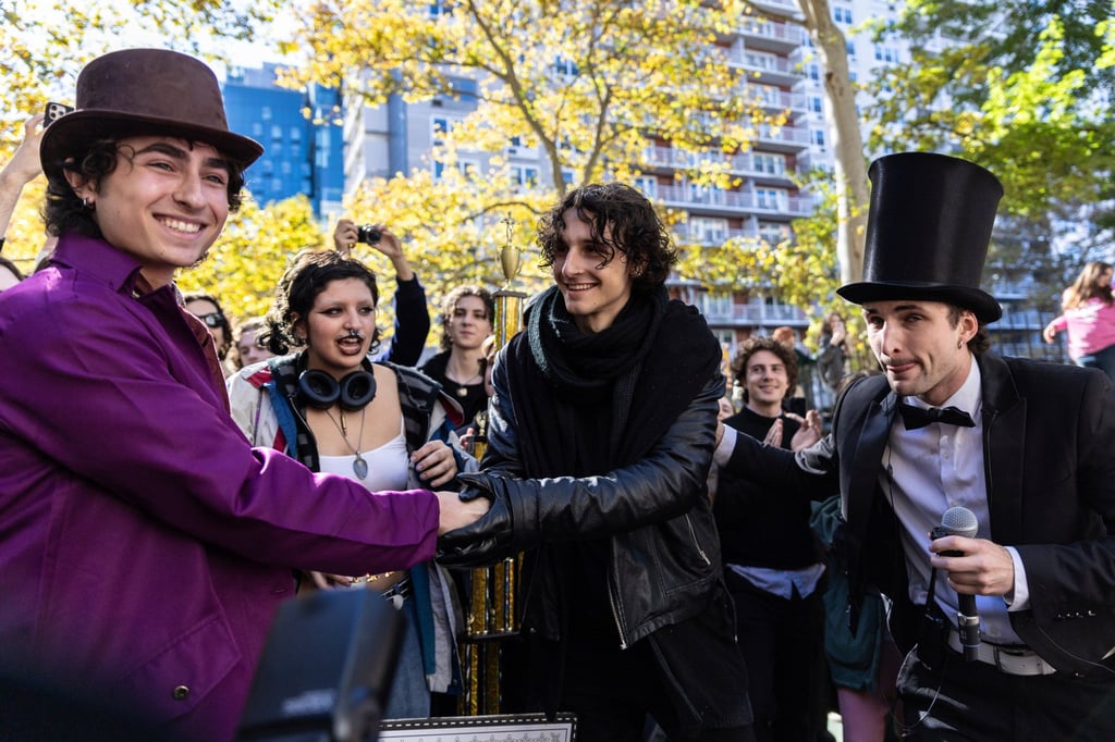 Timothee Chalamet lookalike contest winner Miles Mitchell (left), runner-up Zander Dueve (centre) and organiser Anthony Po (right) in Washington Square Park, New York, in October 2024. Photo: AP
