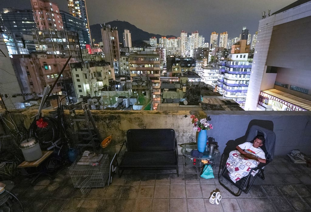 A tenant, surnamed Chan, outside his rooftop home in Sham Shui Po. This image is part of the series “Still living a subdivided life”. Photo: Eugene Lee A tenant, surnamed Chan, outside his rooftop home in Sham Shui Po. This image is part of the series “Still living a subdivided life”. Photo: Eugene Lee