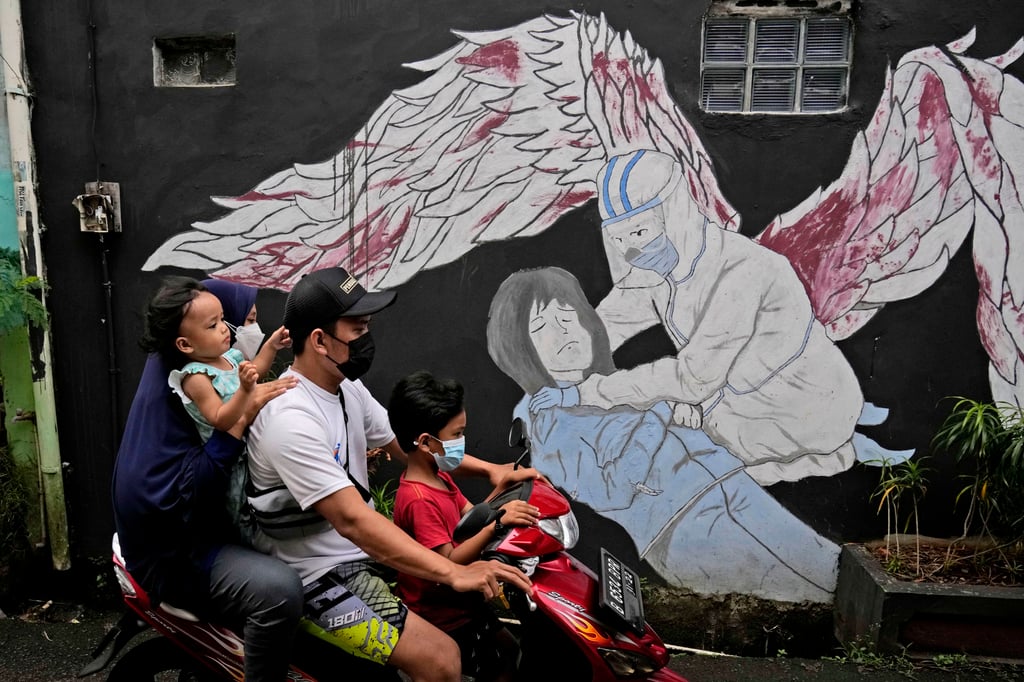 A family rides on a motorbike in Jakarta, Indonesia. Minister Nasaruddin Umar has urged Indonesians to rebuild households “that talk, care, and pray together”. Photo: AP