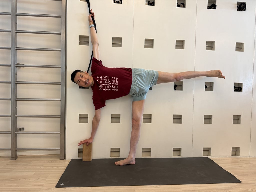 Hong Kong mutual fund executive David Lee uses props to do an Iyengar yoga pose. Photo: IYCHK Hong Kong mutual fund executive David Lee uses props to do an Iyengar yoga pose. Photo: IYCHK