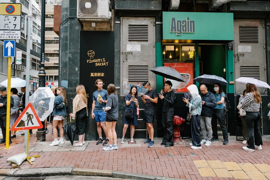 A queue forms ahead of the opening of Pineapple Bakery in Sheung Wan, Hong Kong. Photo: Sarah Kohler