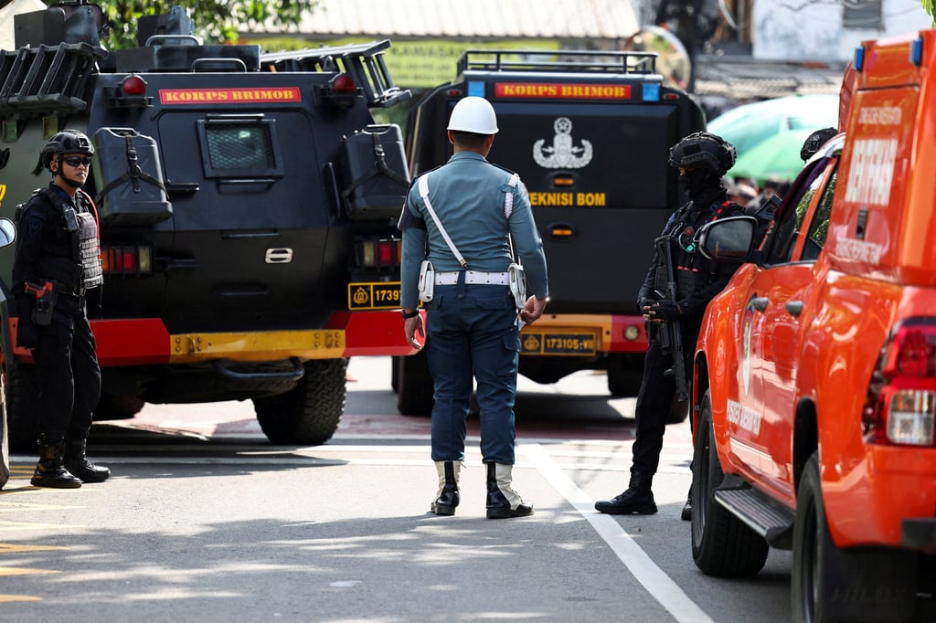 Armed police and military personnel guard near an area after an explosion occurred at a school complex in Jakarta, Indonesia, on Friday. Photo: Reuters Armed police and military personnel guard near an area after an explosion occurred at a school complex in Jakarta, Indonesia, on Friday. Photo: Reuters