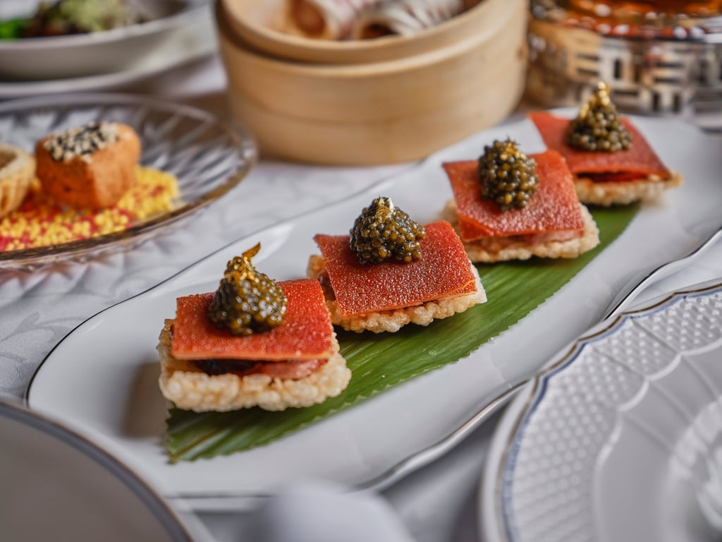 One Harbour Road’s duck liver sausage paired with suckling pig and caviar. Photo: One Harbour Road