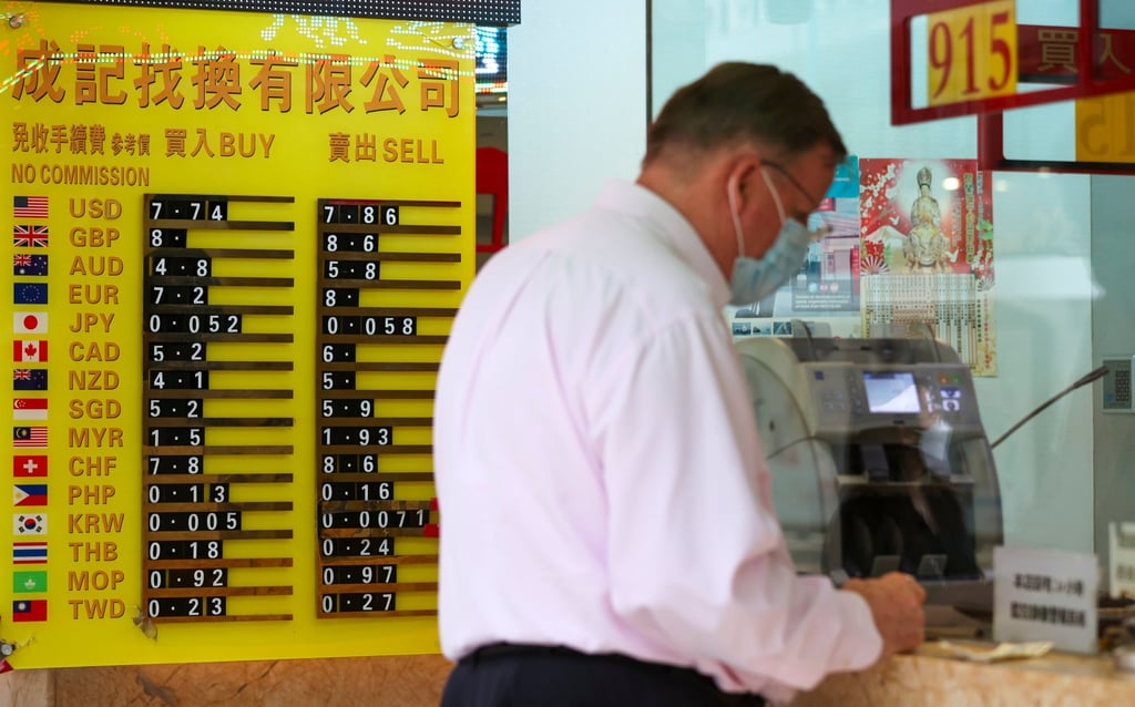 A board shows the exchange rate for various currencies outside a currency exchange shop in Sheung Wan in this file photo from September 2022. Photo: Yik Yeung-man A board shows the exchange rate for various currencies outside a currency exchange shop in Sheung Wan in this file photo from September 2022. Photo: Yik Yeung-man