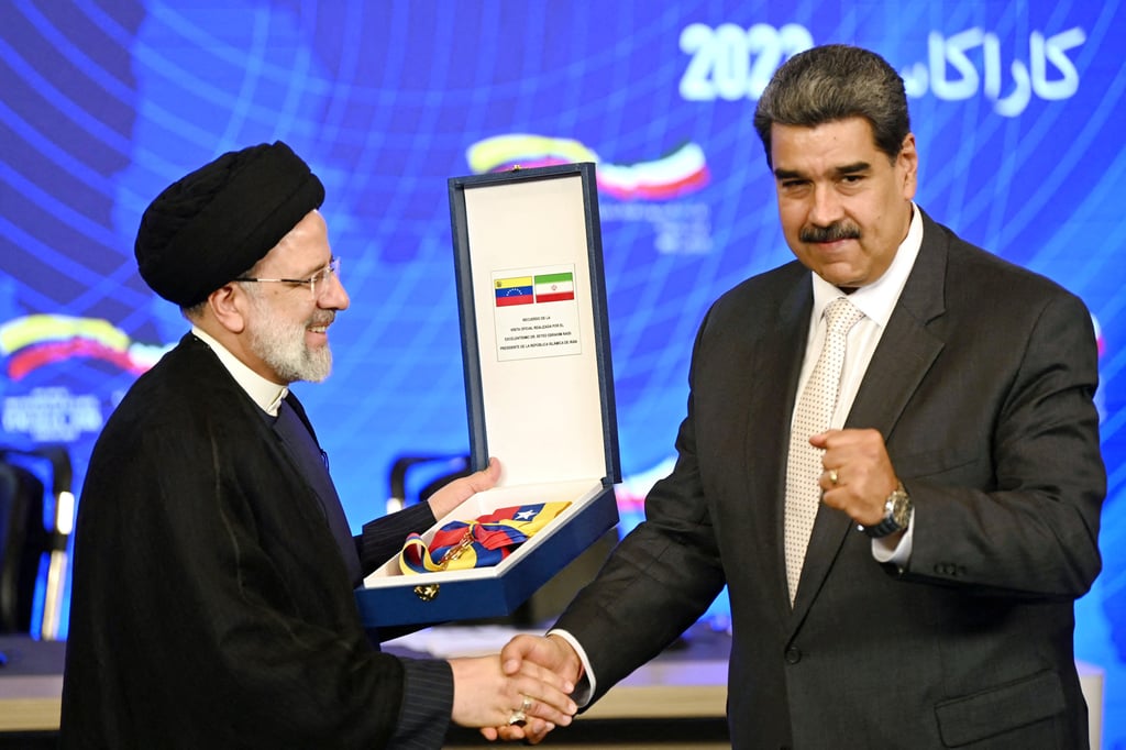 Iranian President Ebrahim Raisi (left) receives a commemorative decoration from Venezuelan President Nicolas Maduro in Caracas in June 2023. Photo: AFP Iranian President Ebrahim Raisi (left) receives a commemorative decoration from Venezuelan President Nicolas Maduro in Caracas in June 2023. Photo: AFP