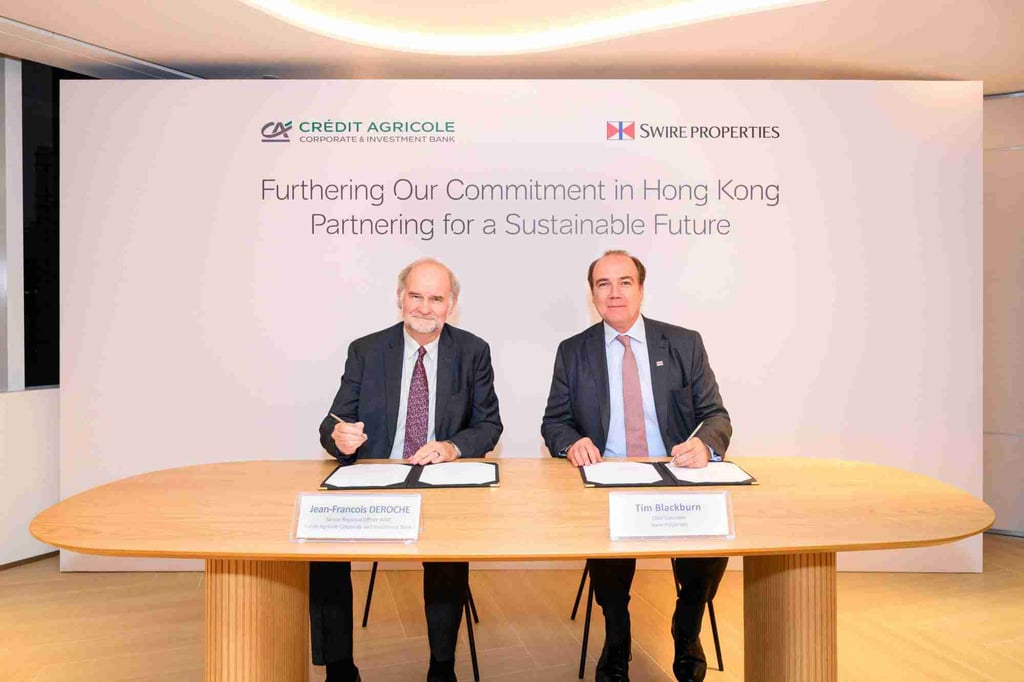 Jean-Francois Deroche of Credit Agricole (left) and Tim Blackburn of Swire Properties sign the new partnership. Photo: Handout Jean-Francois Deroche of Credit Agricole (left) and Tim Blackburn of Swire Properties sign the new partnership. Photo: Handout