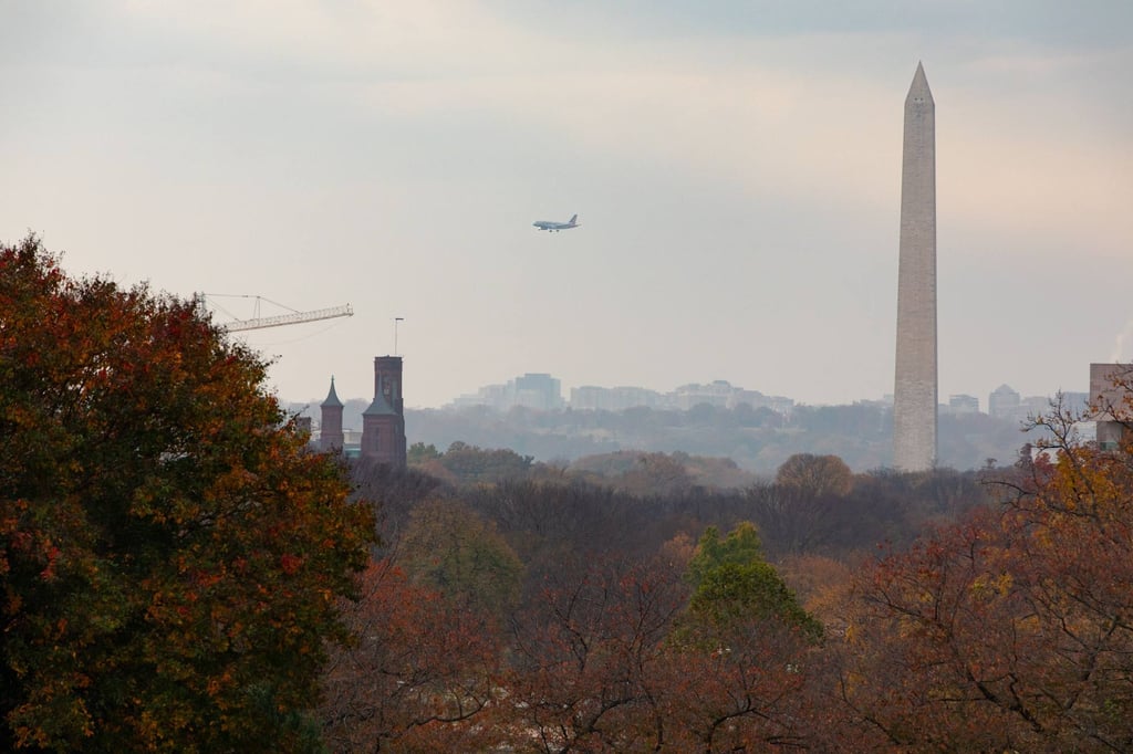 A plane flies over Washington on the 40th day of the government shutdown. Photo: AFP A plane flies over Washington on the 40th day of the government shutdown. Photo: AFP