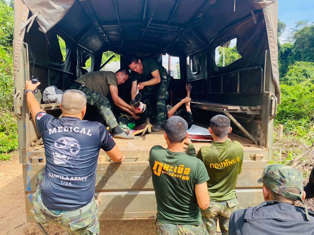 Thai soldiers injured by a landmine during a patrol near the Thai-Cambodia border are treated as they are to be transferred to a hospital on Monday. Photo: Royal Thai Army/AP