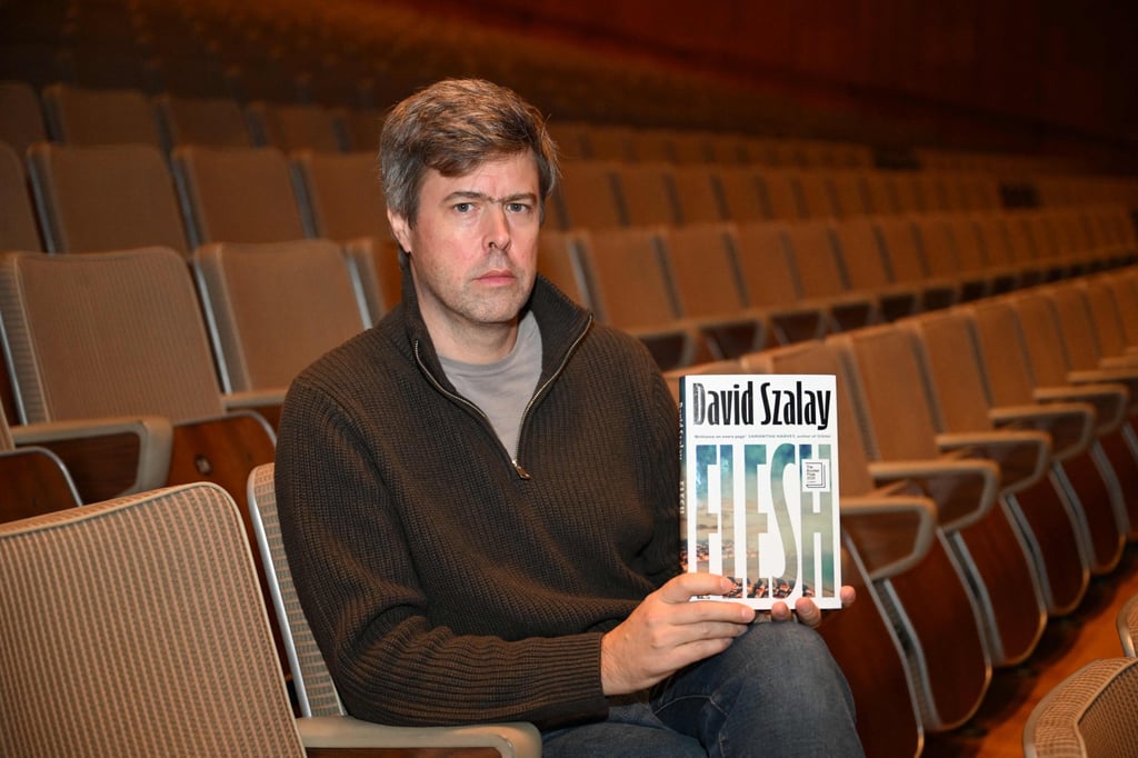 David Szalay with his book ‘Flesh’. Photo: AFP David Szalay with his book ‘Flesh’. Photo: AFP