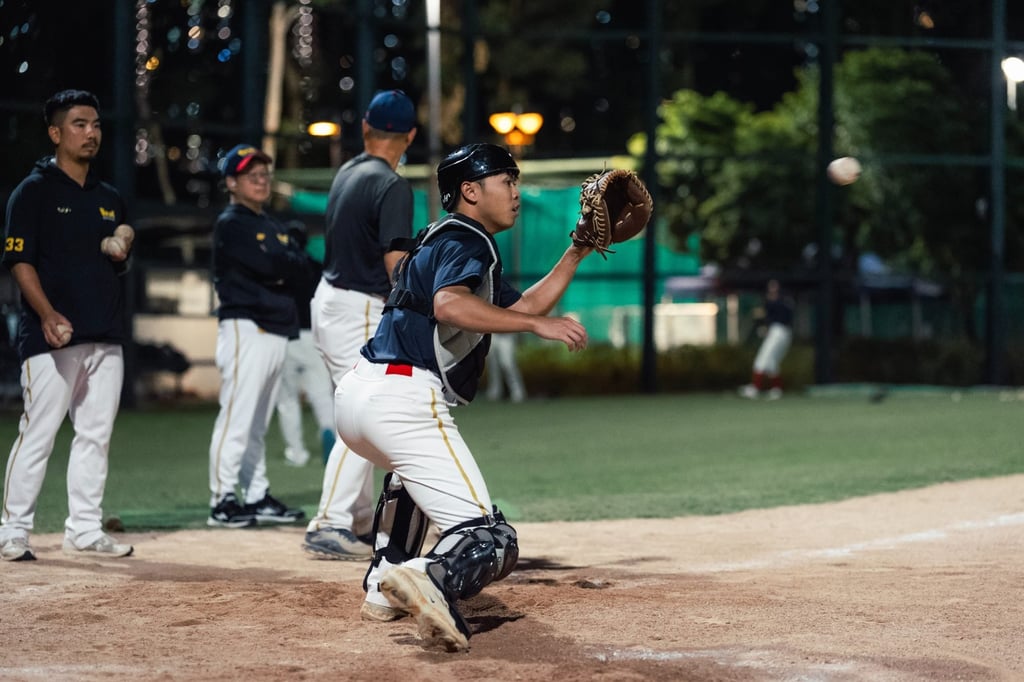 Egon Chan watches the ball into his glove during practice. Photo: BAHKC Egon Chan watches the ball into his glove during practice. Photo: BAHKC