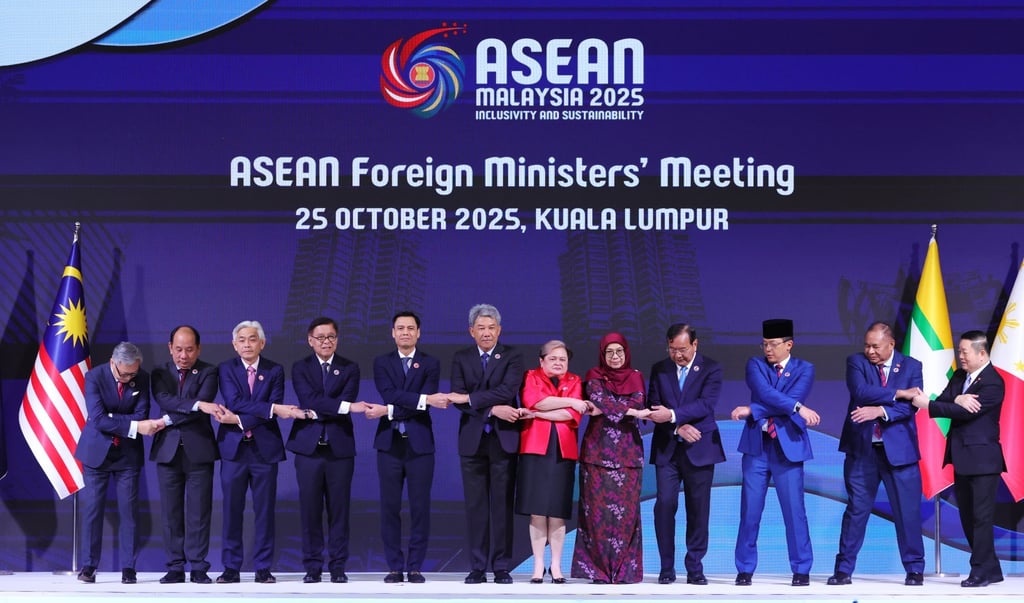 Thailand’s Minister of Foreign Affairs Sihasak Phuangketkeow (fourth from right) joins hands with his regional counterparts at last month’s Asean summit. Photo: EPA