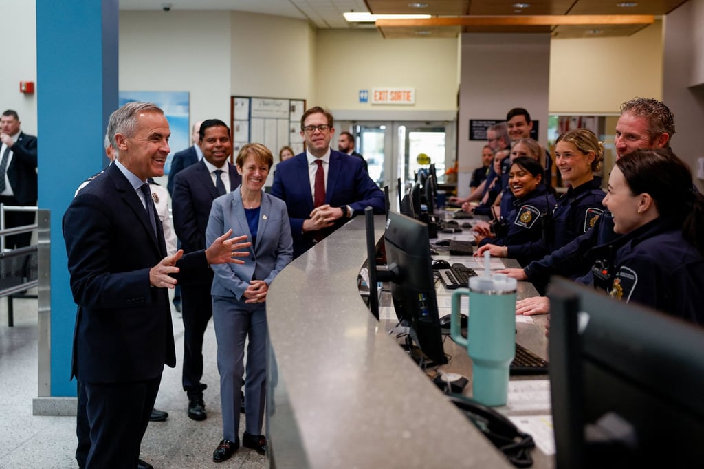 Prime Minister Mark Carney (left) during an event with Canada Border Services Agency members, in Niagara Falls, Ontario, on October 17. Canada is reportedly seeking powers to revoke suspicious visitor visa applications. Photo: Reuters