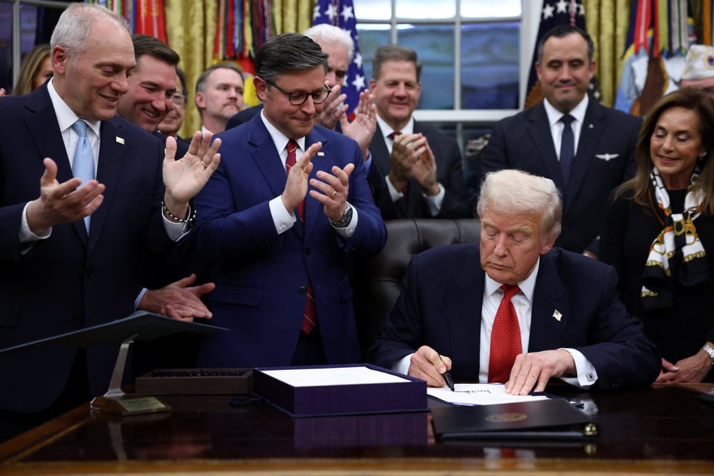 US President Donald Trump signing the funding bill on Wednesday. Photo: Reuters