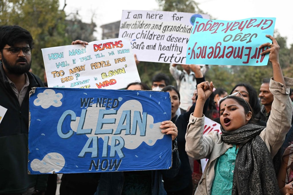 Demonstrators hold posters during a protest demanding the government take action to reduce air pollution in New Delhi on Sunday. Photo: AFP Demonstrators hold posters during a protest demanding the government take action to reduce air pollution in New Delhi on Sunday. Photo: AFP