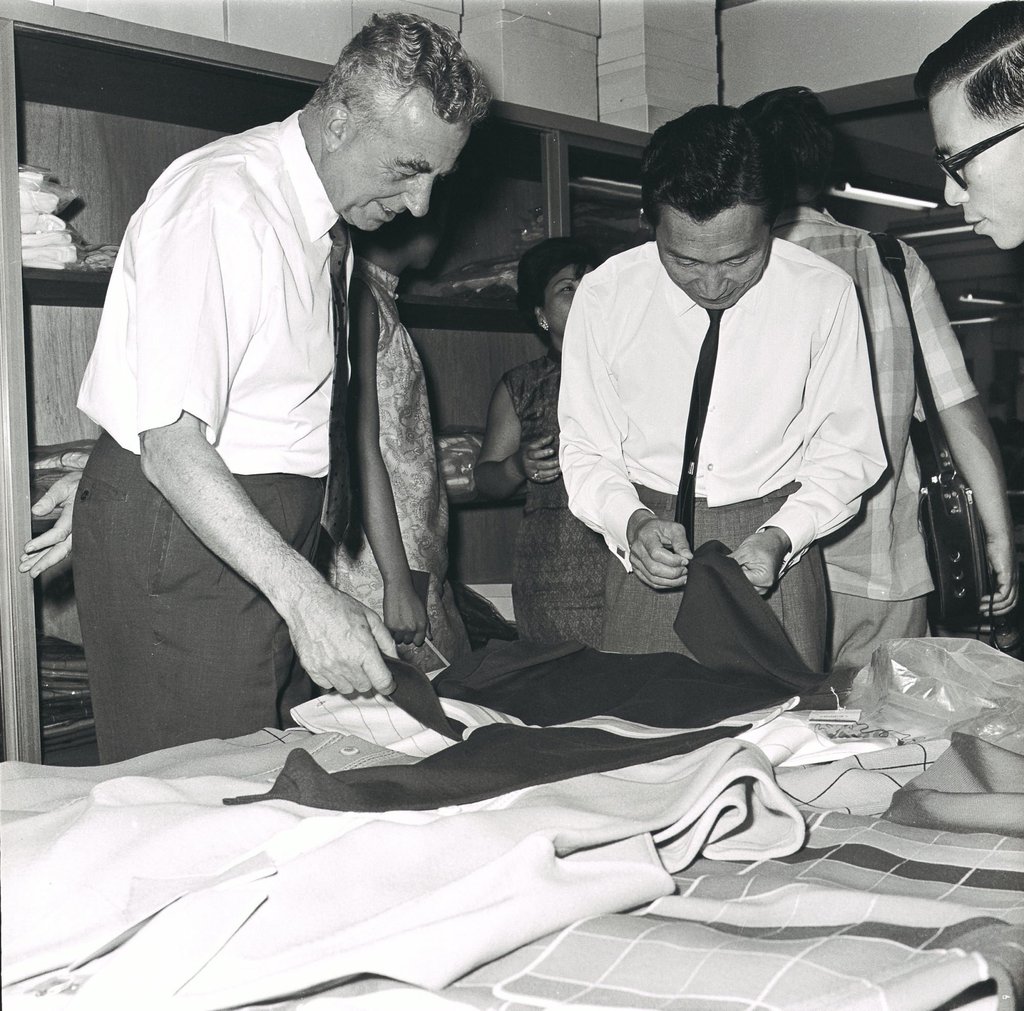 Hong Kong’s Director of Commerce and Industry Terence Sorby (left) looks at fabric samples during a visit to the Fashion Accessories textile factory in North Point in 1967. Photo: SCMP Archives
